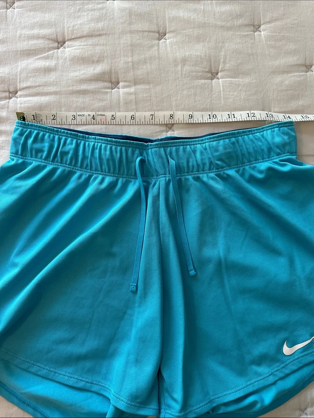 Nike Turquoise Performance Shorts with White Swoosh